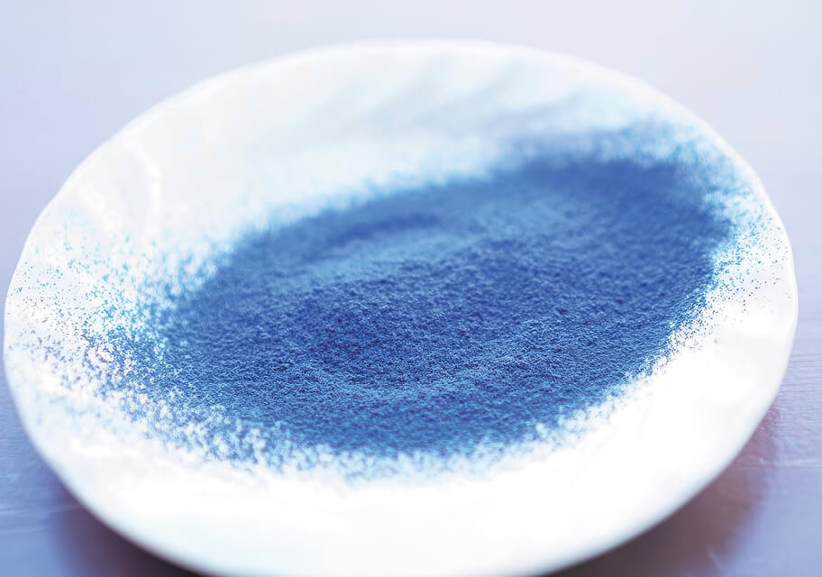 Blue matcha powder on a plate