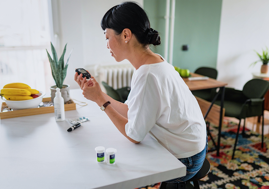 Checking blood glucose while preparing a drink